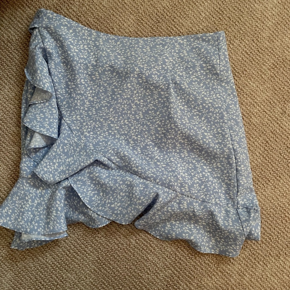 2 shein skirts the blue skirt is size small the black heart skirt is medium